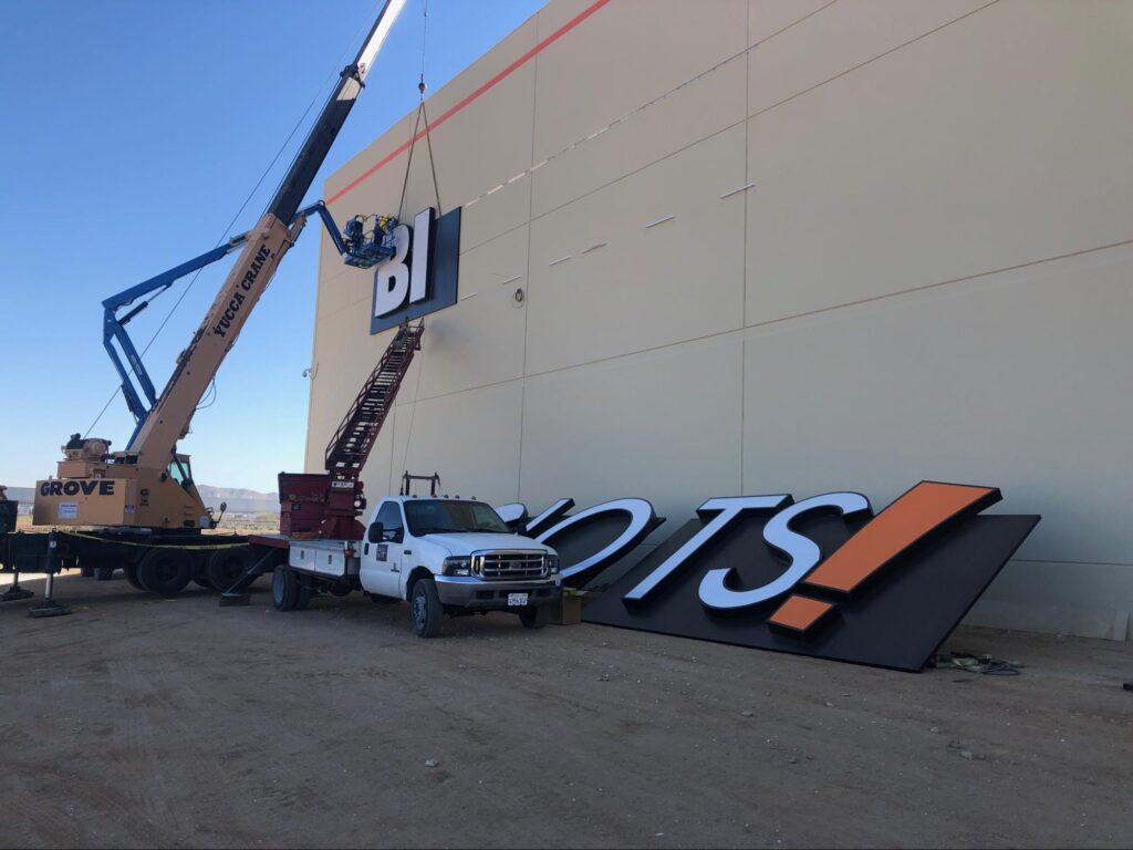 Installation of exterior Big Lots sign demonstrating the best materials for outdoor signs